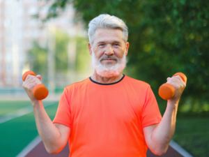 senior man holding dumbbells
