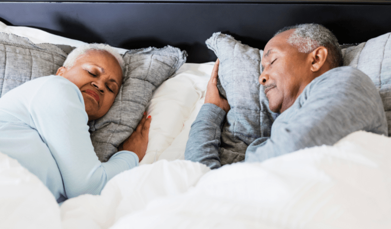elderly couple sleeping together