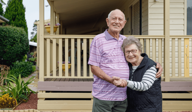 elderly couple hugging