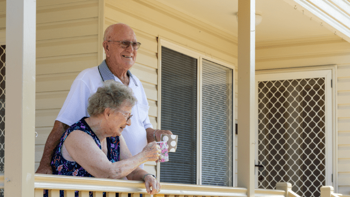 a couple of senior sharing a coffee together