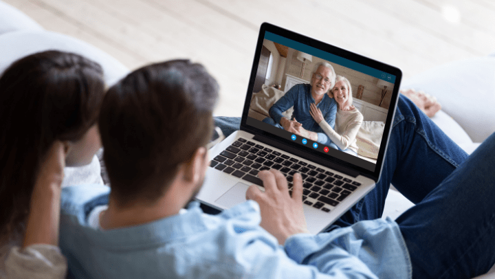 a senior couple on a video call with their family