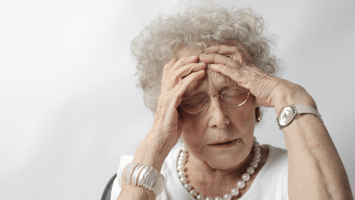 a woman touching her head