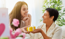 daughter giving mother gift